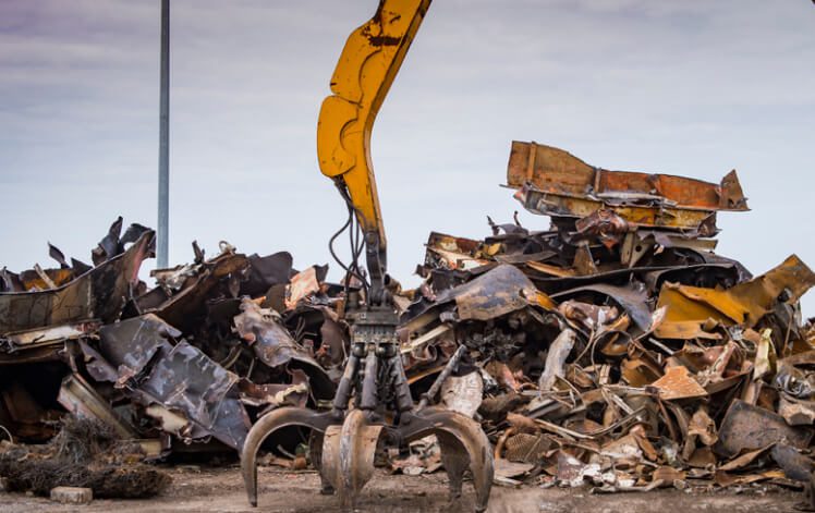 Crane in Mountain of Scrap Metal at Global Commodity Group